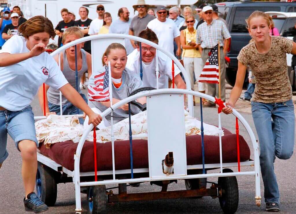 family racing a bed on wheels in beatty nevada