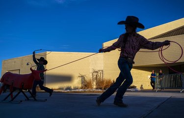 Eleven-year-old Marinna Mori, of Tuscarora, Nev., and her brother, Pete, 8, practice roping outside of the Elko Convention Center during the National cowboypoetrygathering